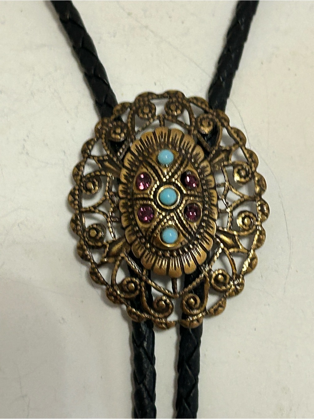 Vintage-Inspired Black Bolo Tie Necklace with Ornate Gold Medallion